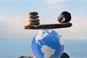 Globe holding the balance of two sets of rocks weighing equally