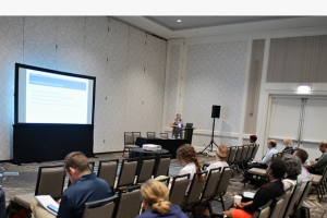 View of session from back left of room.