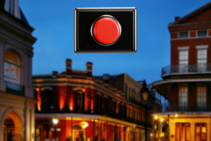 Red reset button over a backdrop of an evening scene