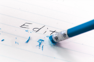 A pencil erasing part of the word "Edit"