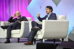 Zachary Pardos and Daniel Knox sitting on the stage at the 110th AACRAO Annual Meeting