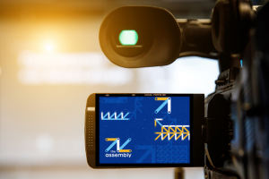 The Assembly logo through a viewfinder