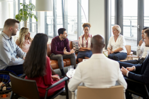 Group of professionals sitting in conversation.