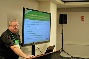 Man presenting a slide deck in a conference room