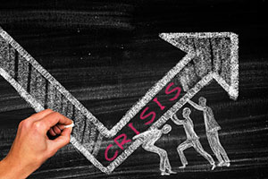 Chalkboard drawing of inviduals changing the trajectory of a crisis situation.