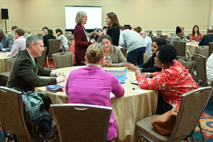 group conversing around a circular table