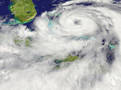 Photo appearing to be taken from space of a large hurricane sitting over an unknown landmass.