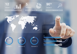 Figure interacting with a holographic screen that's displaying various charts, numbers, and a global map.
