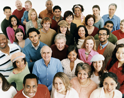 Diverse crowd of people looking up at the camera.
