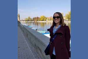 Photo of Katrina Brown in a Burgundy jacket and sunglasses