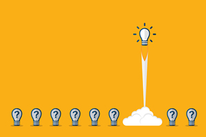 series of lightbulbs with question mark and one lightbulb shooting up like a rocket