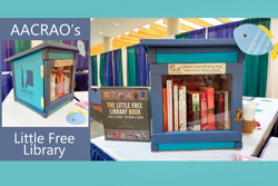 Photo of AACRAO's "little free library" which is in the form of a wooden treehouse or over-sized mailbox.