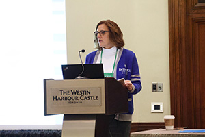 SEM22 presenter speaking at a lecturn.
