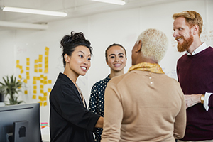 Group of professionals gathered in a discussion.