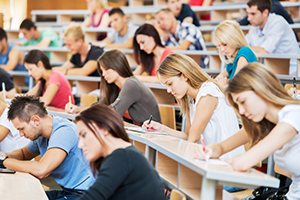Group of students in a university classroom working.