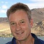 Portrait of a man outdoors in a mountainous landscape