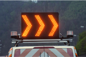 Three orange arrows to direct road traffic