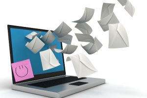 Laptop with emails flying out