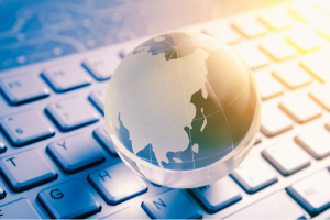Small glass globe on keyboard