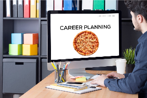 Person at computer with career planning pizza on screen